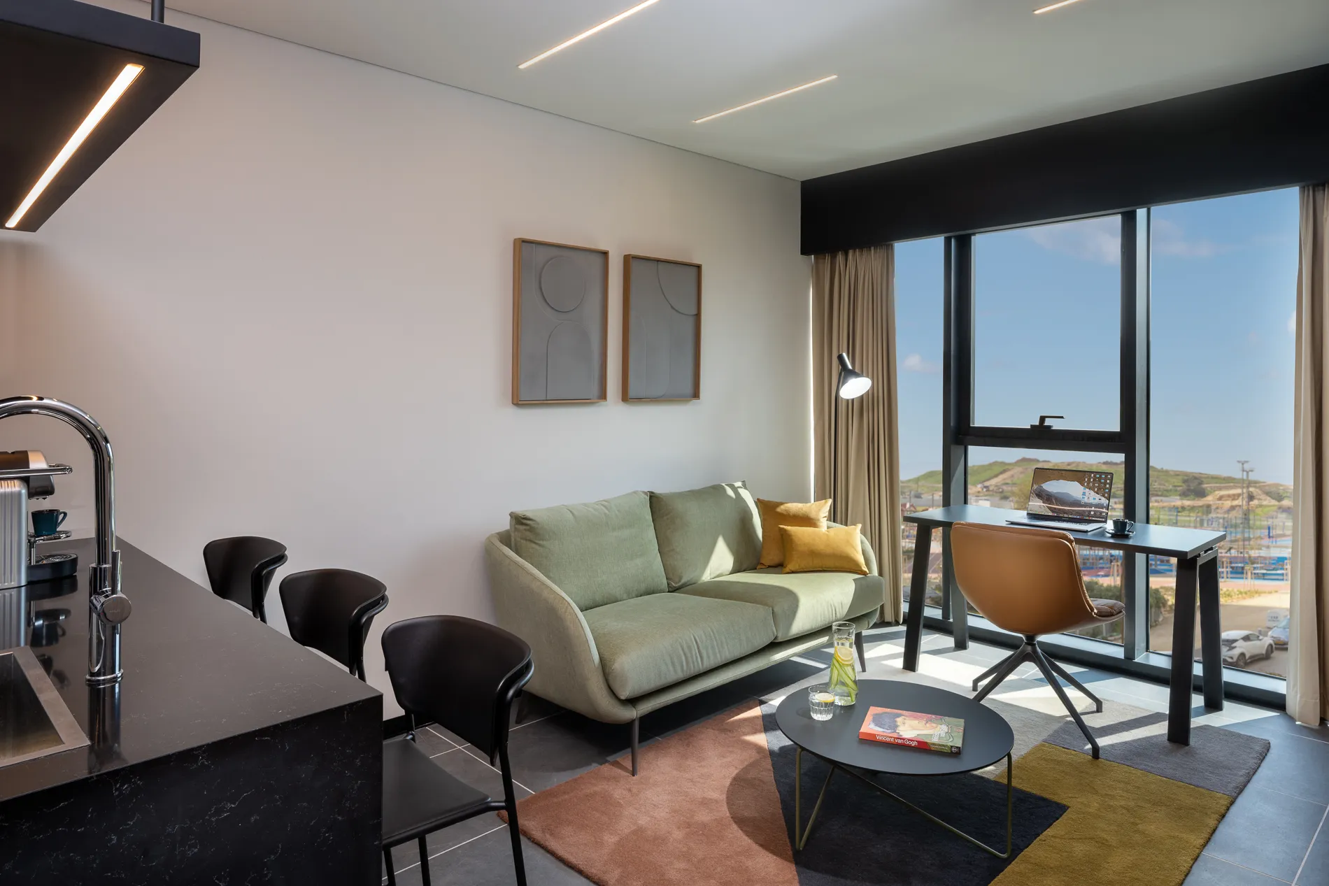 Spacious living area in a master Bat Yam apartment, featuring a cozy sofa and stylish decor for a relaxing ambiance.