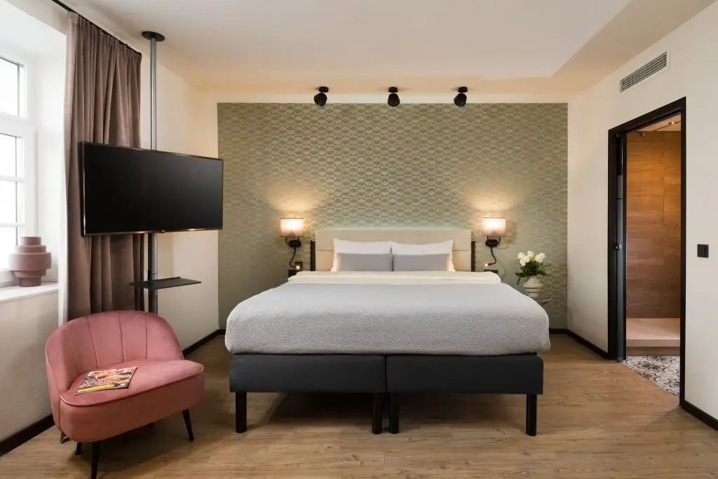 Cozy and well-appointed bed at master Mirabell for ultimate comfort